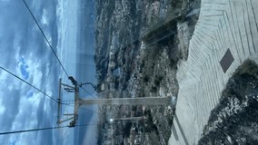 View of Benalmadena from cableway
cabin ascending to Monte Calamorro. Vertical video. Malaga, Spain. 