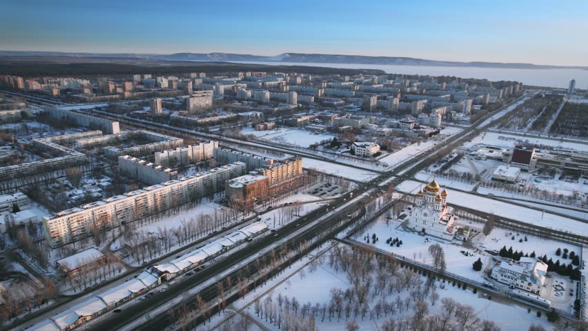 Aerial view. Winter panorama of the city of Tolyatti in the Samara region. Snow-covered streets of a provincial and industrial Russian city. Royalty-Free Stock Footage #1103646883