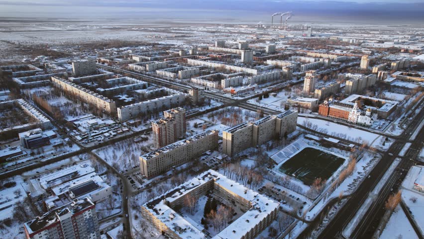 Aerial view. Winter panorama of the city of Tolyatti in the Samara region. Snow-covered streets of a provincial and industrial Russian city. Royalty-Free Stock Footage #1103646899