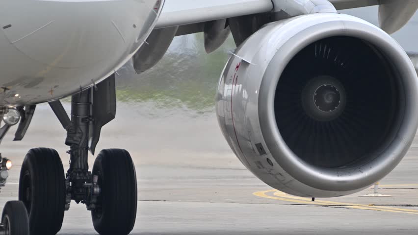 Huge airplane jet engine close up view moving forward heat haze distant airplane lining up behind. 4k super slow motion raw video 120 fps Royalty-Free Stock Footage #1103648663