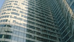 Office building windows and bottom view of skyscraper building with many corporate offices of successful companies. Real estate rental and commercial use. - Powered by Shutterstock - Get 15% off with code: PIKWIZARD15
