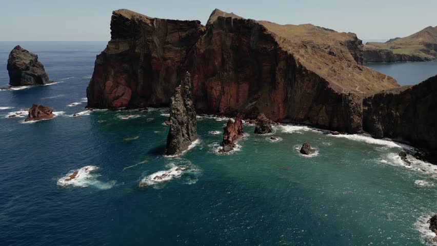 Waves Crashing Against The Sea Stacks And Cliffs In Ponta de Sao Lourenco In Madeira Island, Portugal. - aerial  Royalty-Free Stock Footage #1103659161