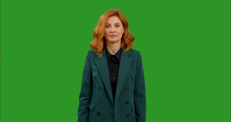 Stressed angry woman screaming at chromakey background looking at camera. Portrait of furious overwhelmed Caucasian lady expressing anger and fury at green screen. Stress concept. Royalty-Free Stock Footage #1103662203