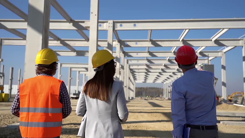 Mixed Construction Team Walking in Slow Motion and Discuss a Project at Future Factory Construction Site. The Importance of Gender Diversity in Construction. Gender-Balanced Teams Do Better Work. Royalty-Free Stock Footage #1103669865