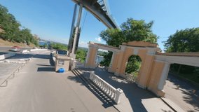 FPV drone, Arches of friendship of peoples in Kiev. Historical sights of Ukraine, FPV drone , Reunion Arch, Kyiv: People's Friendship Arch and Volodymyr Hill bridge. View of the park and pedestrian 