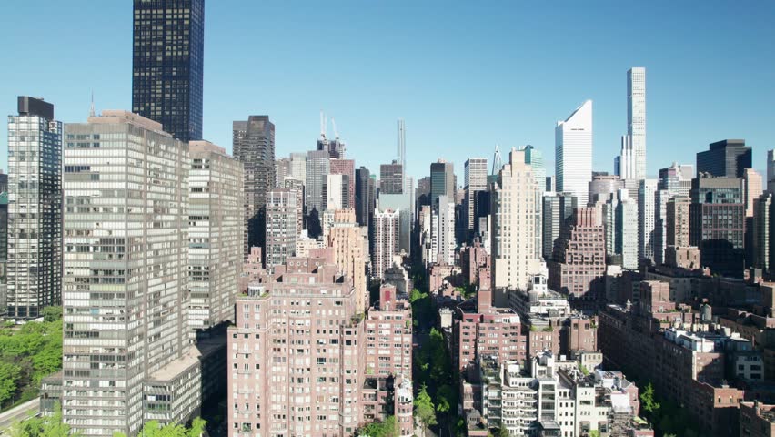 Urban jungle in New York. Maze of Manhattan apartments, offices and high-rise buildings, 4K aerial shot.