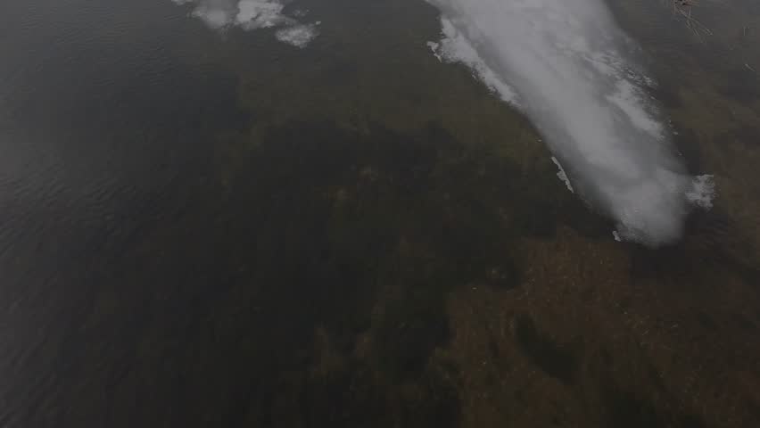 River leading to frozen lake in Ely, St. Louis County, Minnesota in winter