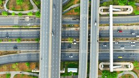 Highway interchanges or highway junctions, are specialized road segments designed to facilitate the movement of traffic between different highways or major roads. Transportation concept. Drone. 4K HDR