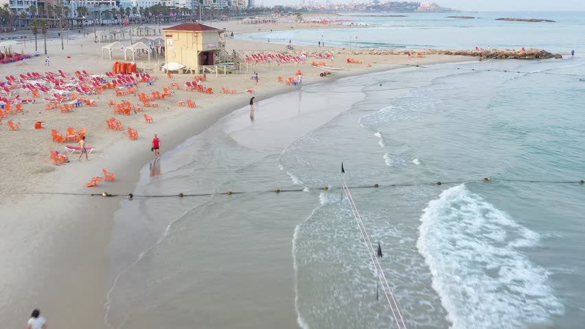 l Forward Shot Of Orange Chairs On Beach In City Against Sky - Tel Aviv, Israel