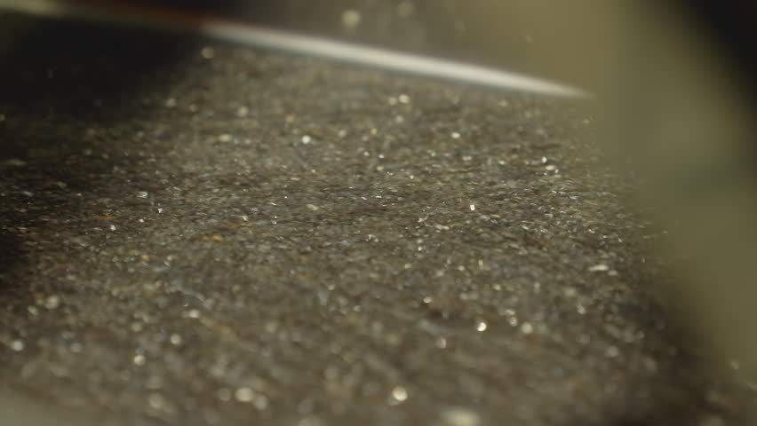 Close Up Of Rich Precious Metal Gold Granules Falling From Tray. Precious Metal Granules Valuable Material Extraction. Pouring Precious Metal Pieces. Gold Dust Granules. Refining. Jewelry Production Royalty-Free Stock Footage #1103693711