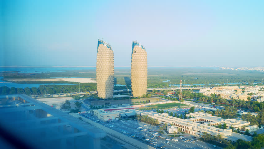 AbuDh-UAE-Feb,19 2018: Time lapse window automatically open  of the innovative, eco-friendly 29-storey twin Al Bahr Tower after sunset. Royalty-Free Stock Footage #1103694407