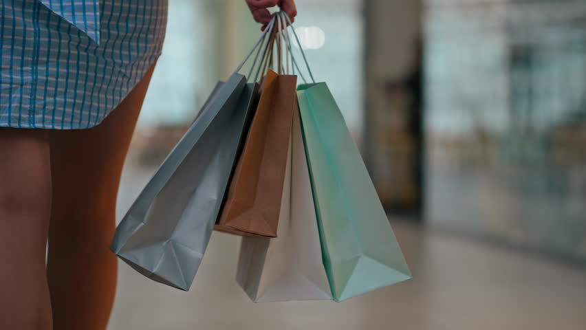 Shopping Mall, Woman In A Clothing Store Relaxingly Holding Paper Bags In A Supermarket, General Royalty-Free Stock Footage #1103694705