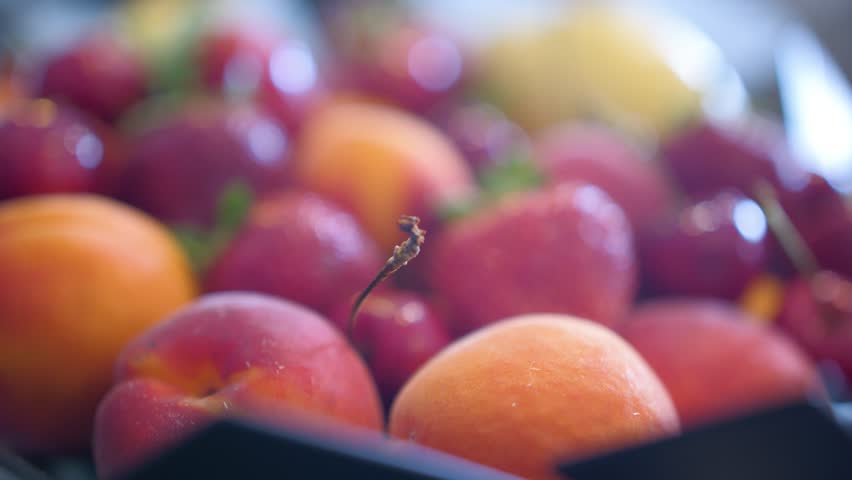 Closeup of colorful assortment of mouth watering fresh fruits in market