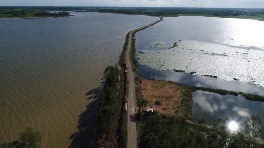 Top view of road in between wetland area in West Bengal in India