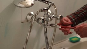 Plumber hands fixing water tap with spanner - Powered by Shutterstock - Get 15% off with code: PIKWIZARD15