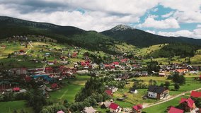 Aerial view of Bukovel village in carpathian mountains ukraine, 4k video from the drone, summer landscape