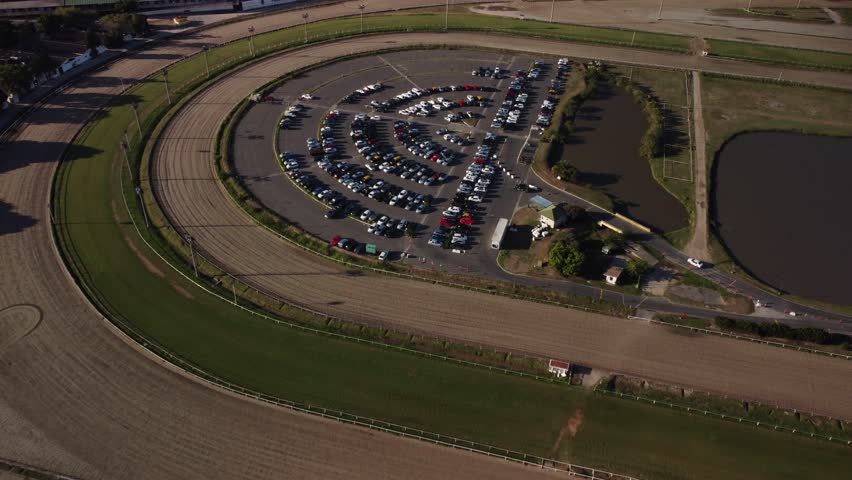 Car parking at racing track, drone view.