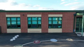Aerial view of an elementary school. Brick exterior of an American public education building. - Powered by Shutterstock - Get 15% off with code: PIKWIZARD15