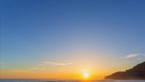 time lapse golden sky in sunset above the sea. aerial view golden sky in sunset above the sea video 4K. Nature video High quality footage. Scene of Colorful romantic sky sunset background.
