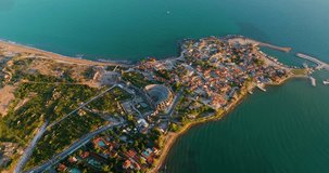 Aerial drone video of Side, Antalya, showcasing the beautiful coastal landscape, ancient ruins, and charming seaside town in Turkey.