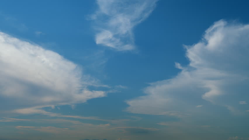 Sky with bautiful silky clouds. Puffy fluffy cumulus or cirrocumulus clouds. Timelapse.