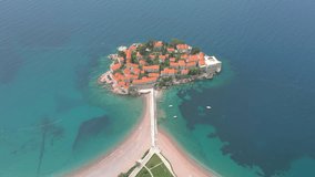 Sveti Stefan. Montenegro. Fantastic aerial view of the beach and Sveti Stefan island. Beautiful architecture and the blue Adriatic Sea.