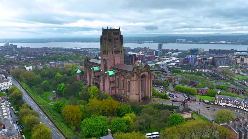 Aerial view of the Liverpool Cathedral, the seat of the Bishop of Liverpool and the biggest cathedral in Britain, UK Royalty-Free Stock Footage #1103741147