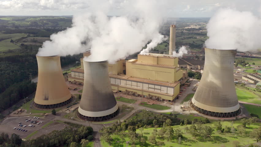 Aerial orbit around coal-fired power station in Victoria, Australia. Yallourn burns fossil fuels to generate thermal energy to produce steam that can turn turbines to generate electricity.