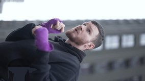 Vertical video slow motion training of male boxer