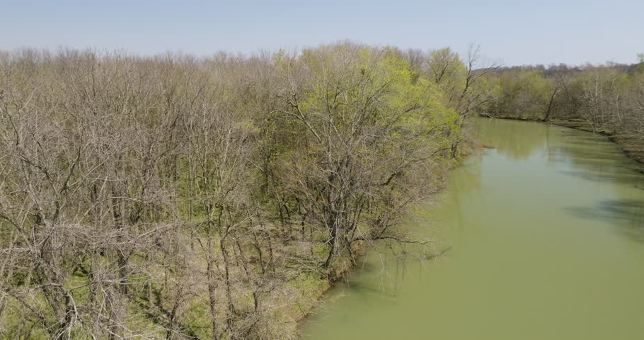 Greenish Stagnant Water Surrounded By Leafless Trees At The Middle Fork Of White River In Washington County, Arkansas. aerial pan right