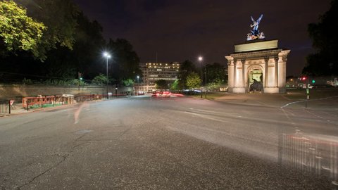 LONDON, ENGLAND - JULY 01: In this time-lapse view vehicles move by Wellington Arch at night on July 01, 2010 in London, England