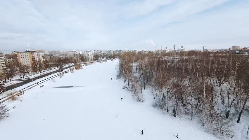 FPV shooting of a girl on cross-country skiing, aerial shooting of a girl skier