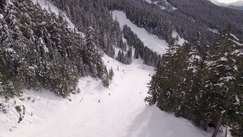 Whistler mountain Creekside ski hill at sunset, aerial footage, sunset, winter, ski hill. 5.4k 24fps