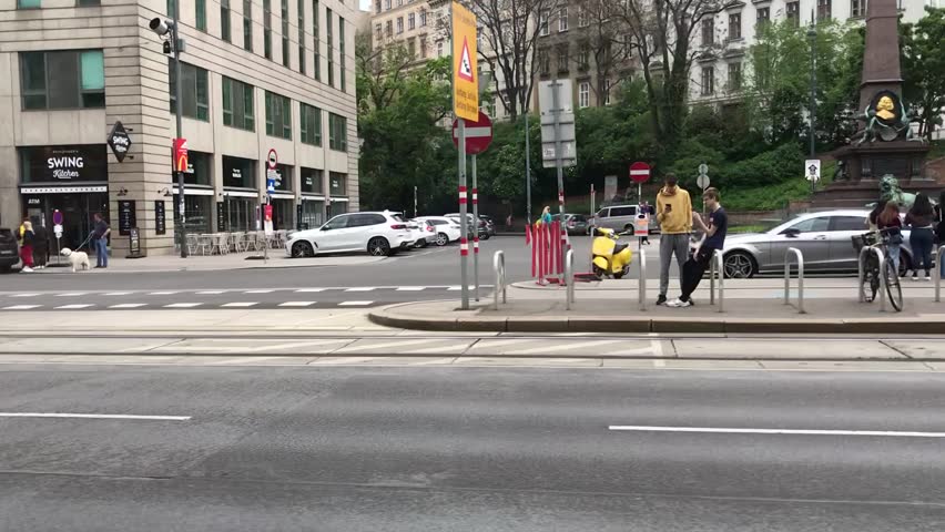 Vienna, Austria - May 6, 2023 - Ring Road Vienna Historic Palace District Tram Road Trip Spring Saturday Cityscape, Universitätsring, Vienna City Hall Neighborhood, Downtown, Innere Stadt 1st District