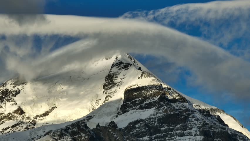 Aerial video of the peak of Mount Shekhara Georgia covered with clouds