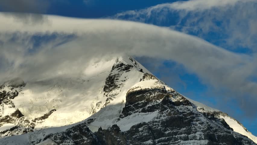 Aerial video of the peak of Mount Shekhara Georgia covered with clouds