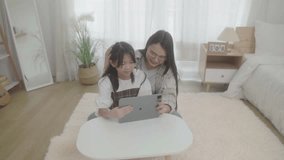 Mother help girl child with home task preparation. Online education concept. Young mom do homework learn distant use computer with daughter. 