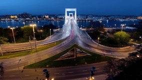 Light trails footage about Budapest. This is a Dobrentei square and Erzsebet bridge on the background. 
Main theme is the evening traffic. 
Budapest Hungary citysacepe in blue hour. 