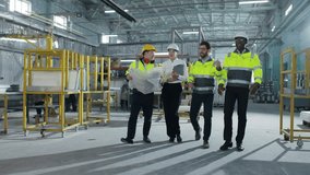 Multicultural engineers dancing at modern manufacturing factory and clapping hands. Employees in safety hard hats celebrating succsess at background of welding sparks flying. - Powered by Shutterstock - Get 15% off with code: PIKWIZARD15