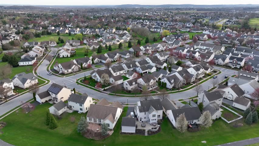 Suburban neighborhood in America. Aerial shot of family homes on a quiet street.