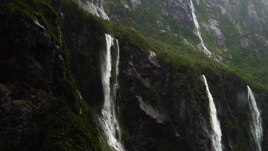 Waterfalls On The Mountain In Milford Sound During Rainstorm In New Zealand. - POV