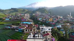 Aerial view of Nepal Van Java tourist village on the slope of Sumbing Mountain. A colorful village in Indonesia, which is similar to the Namche Bazaar in Nepal