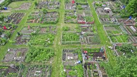 Urban gardening. City urbanized vegetable garden. Aerial view. Growing, farming vegetables in the city. Agriculture of organic hand grown food. Self sustained system of gardening reusing rainwater. - Powered by Shutterstock - Get 15% off with code: PIKWIZARD15