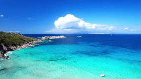 Italy summer holidays. Sardegnia island . village Santa Teresa di Galura in northern part with turquoise sea and beautiful beach. aerial drone overflight video