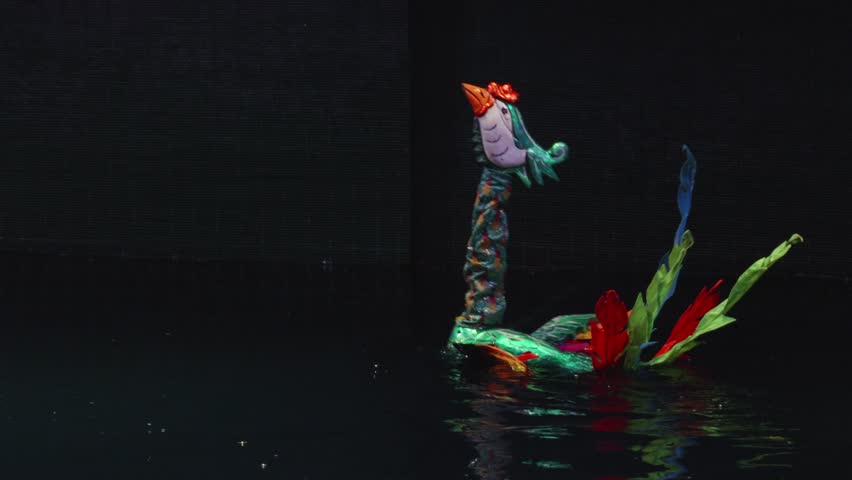 Couple of Phoenix Bird Puppet Dancing In The Water In Thang Long Water Puppet Theatre In Hanoi, Vietnam. - close up