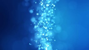 Vertical video animation of blue light shine particles bokeh over blue background - abstract particles background