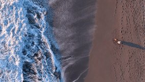 Mother and son view from the drone vertically down static frame in slow motion at sunset rest concept happy family funny go for are running a teamwork Silhouette, happy children with mother and father - Powered by Shutterstock - Get 15% off with code: PIKWIZARD15