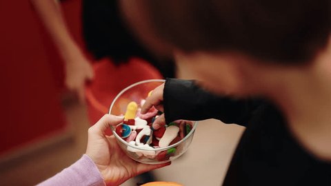 Group of kids wearing halloween costume receiving candies at home 스톡 비디오