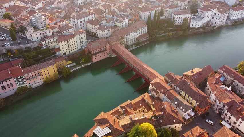 Bassano del Grappa historical bridge panoramic aerial view in a sunny day with flare. Royalty-Free Stock Footage #1103803849