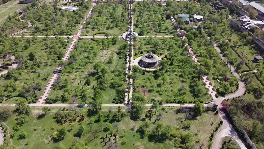 Badam Wari Park in Srinagar, a serene oasis adorned with blooming almond trees. Immerse yourself in the beauty of nature and enjoy a peaceful retreat. Perfect for travel, nature, and relaxation themes